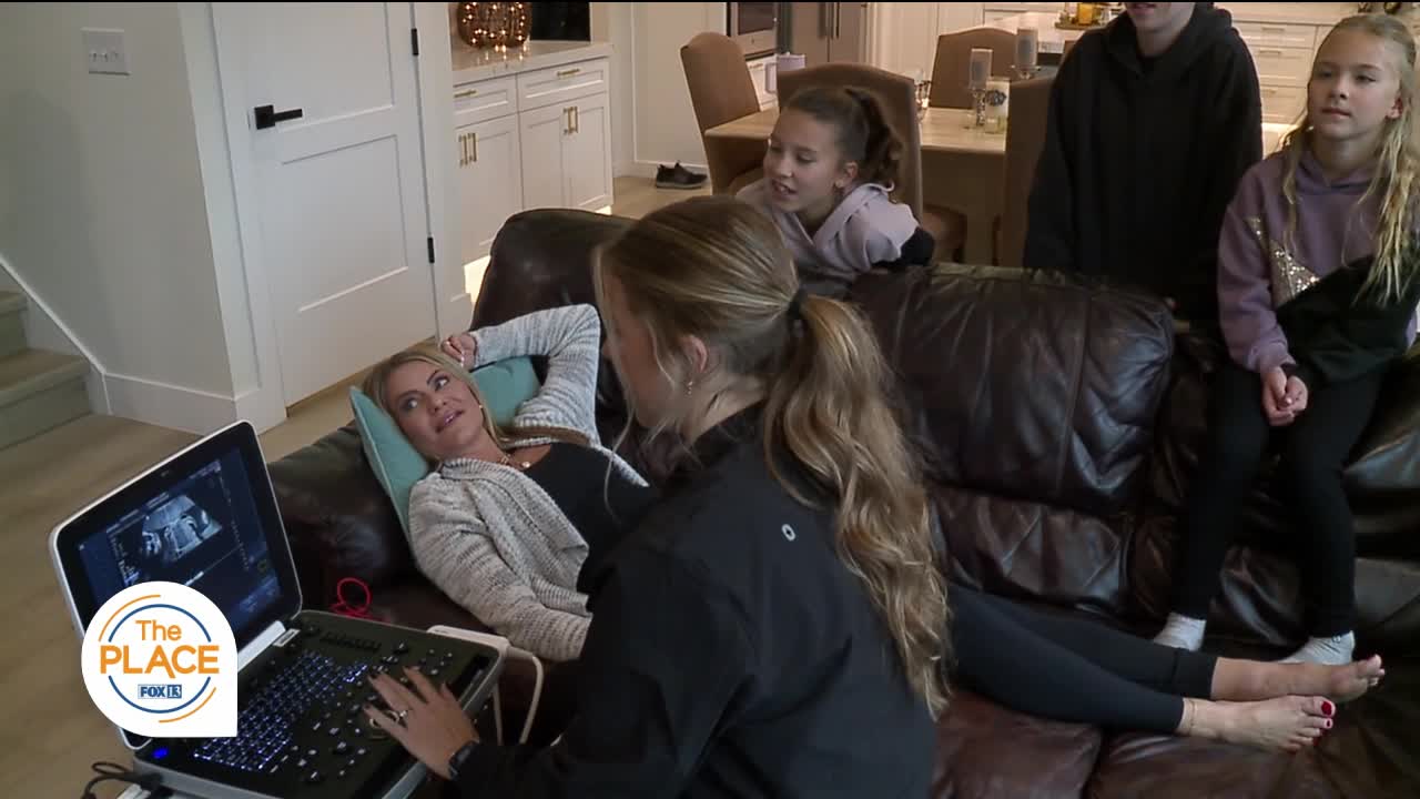 Fox 13 The Place segment: Roam Imaging founder Kailey Mansfield performing an at-home ultrasound for Jenny Hardman with her family gathered around